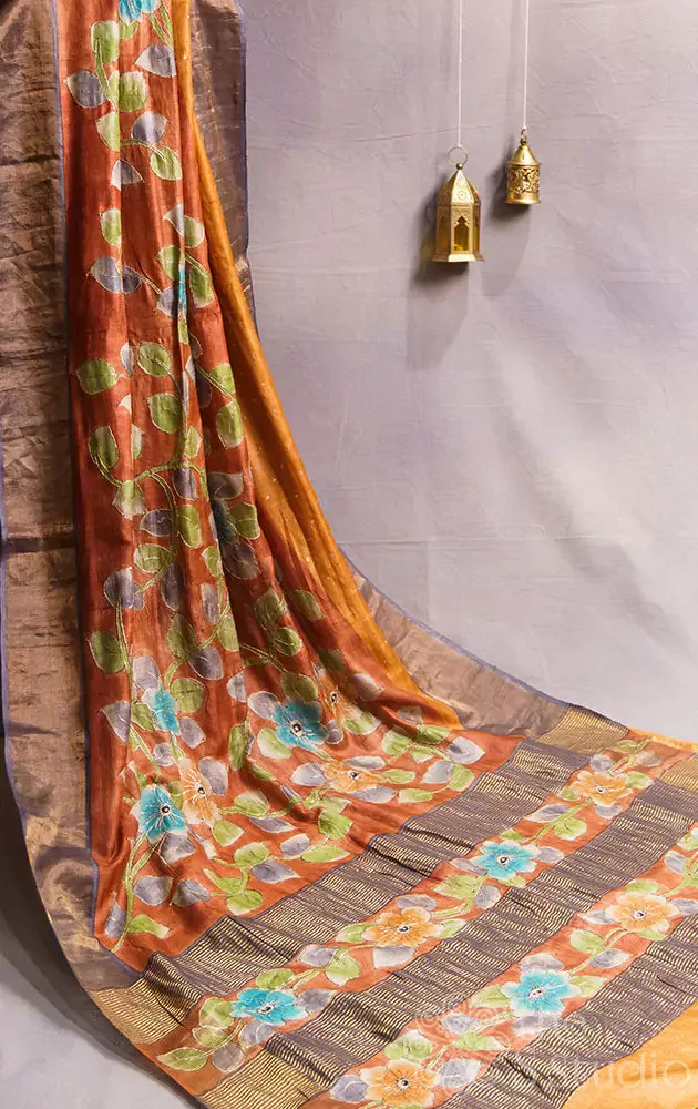 Brown tussar silk saree with floral prints and zari border